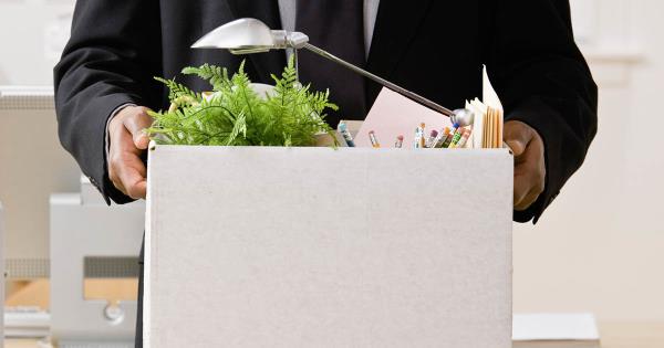 Man holding box of office items